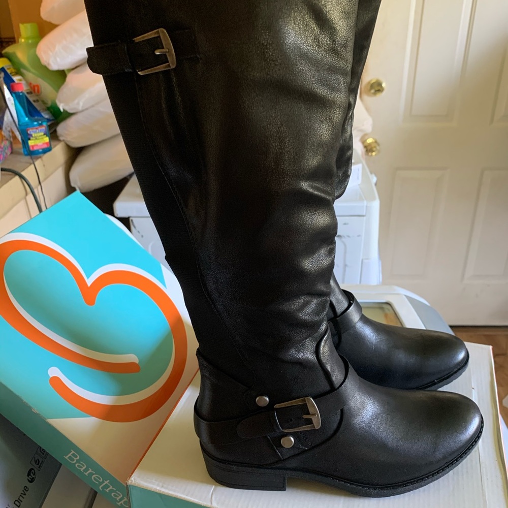 Riding boot in black vegan leather.New in box